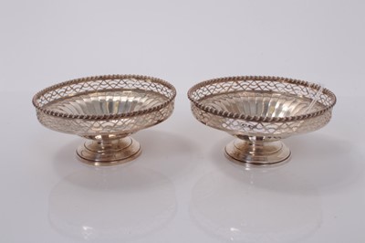 Lot 149 - Pair of George VI silver bonbon dishes with pierced borders on pedestal bases, (Birmingham 1937), maker Adie Brothers 3ozs, 11cm in diameter (2).