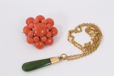 Lot 516 - Antique coral brooch and a green nephrite pendant on 9ct gold chain