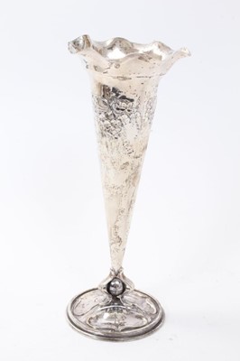 Lot 407 - Victorian silver spill vase in the Art Nouveau style of tapered form, with flared rim and embossed floral decoration, on circular base, (London 1898), maker Goldsmiths & Silversmiths Compant, all a...