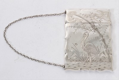 Lot 421 - Late 19th century American silver card case of rectangular form with engraved decoration depicting a Heron and suspension chain, marked Sterling, in outer box, 9 x 6.5cm