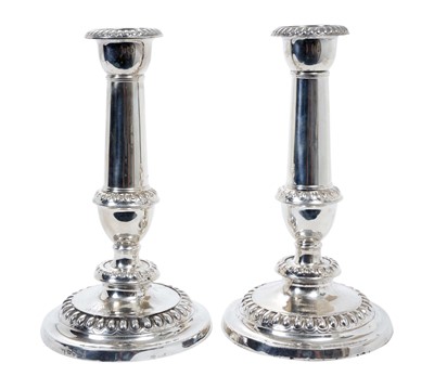 Lot 422 - Pair of George III silver candlesticks with plain columns, removable sconces and egg and dart borders, (Sheffield 1811), maker Thomas Blagden & Co, 24.5cm in overall height (2)