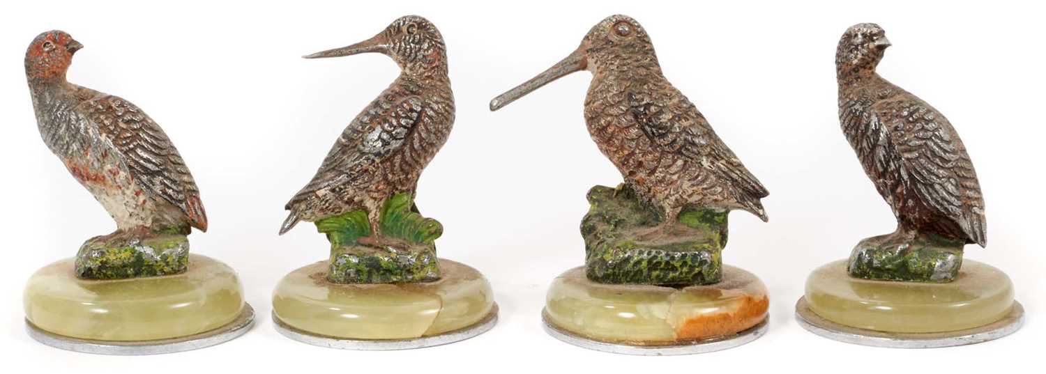 Lot 957 - Four Austrian cold painted place name/menu holders in the form of Woodock, Snipe and Grouse, on circular onyx and chromium plated bases, 4cm high