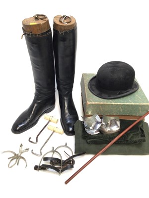 Lot 955 - Pair of black leather hunting boots with wooden trees, boot pulls, spurs, riding bowler hat and related items