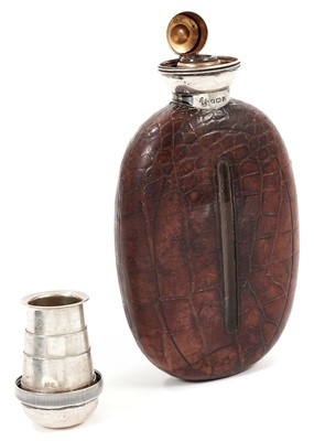 Lot 953 - Unusual George V silver topped glass hip flask of oval form mounted in simulated crocodile skin leather, the screw top with collapsible cup, (Birmingham 1910), maker Charles Boyton & Sons, 15cm hig...