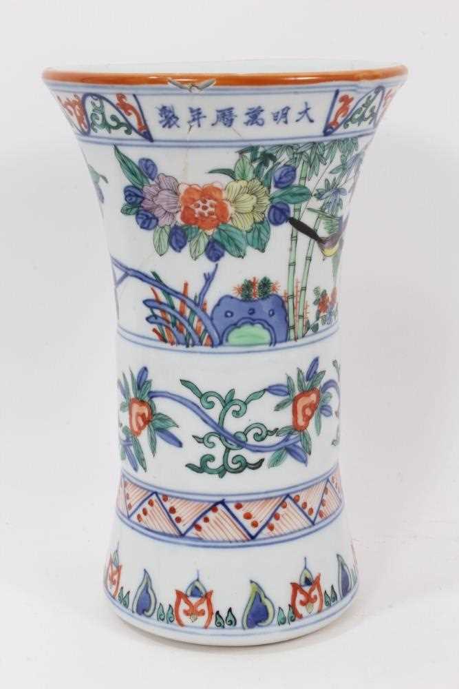 Lot 943 - Chinese Gu vase, decorated in the Wucai style with bands of birds and flowers, six-character Wanli mark around rim, 24cm high