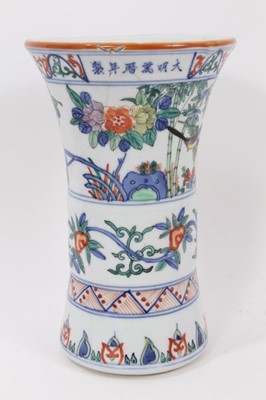 Lot 227 - Chinese Gu vase, decorated in the Wucai style with bands of birds and flowers, six-character Wanli mark around rim, 24cm high
