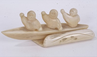 Lot 985 - Fine 1930s Eskimo walrus ivory carving of three rowers in a canoe, 12.5cm