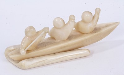 Lot 985 - Fine 1930s Eskimo walrus ivory carving of three rowers in a canoe, 12.5cm