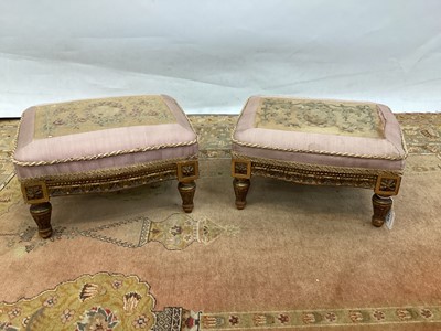 Lot 1439 - Unusual pair of 19th Century carved giltwood footstools each with tapestry top raised on shaped frieze and fluted legs