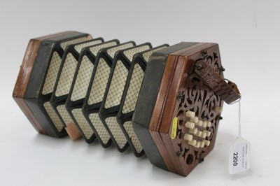 Lot 2200 - Victorian concertina by Butler of Haymarket, London, with fretwork ends and ivory buttons