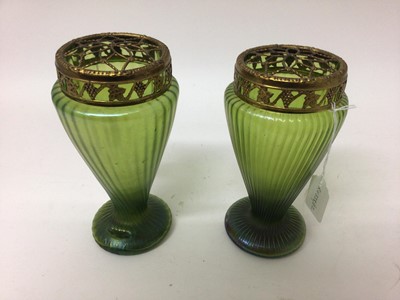 Lot 1003 - Two Art Nouveau Loetz style iridescent green glass rose vases with original gilt metal mounts