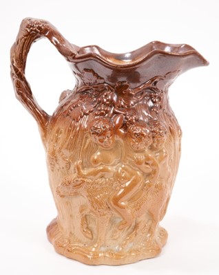 Lot 30 - Early 19th century salt glazed Bacchanalian jug