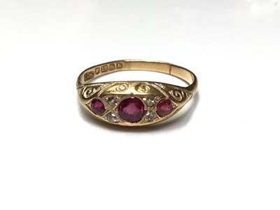 Lot 34 - Edwardian 18ct gold ruby and diamond ring in carved scroll setting (Birmingham 1901)