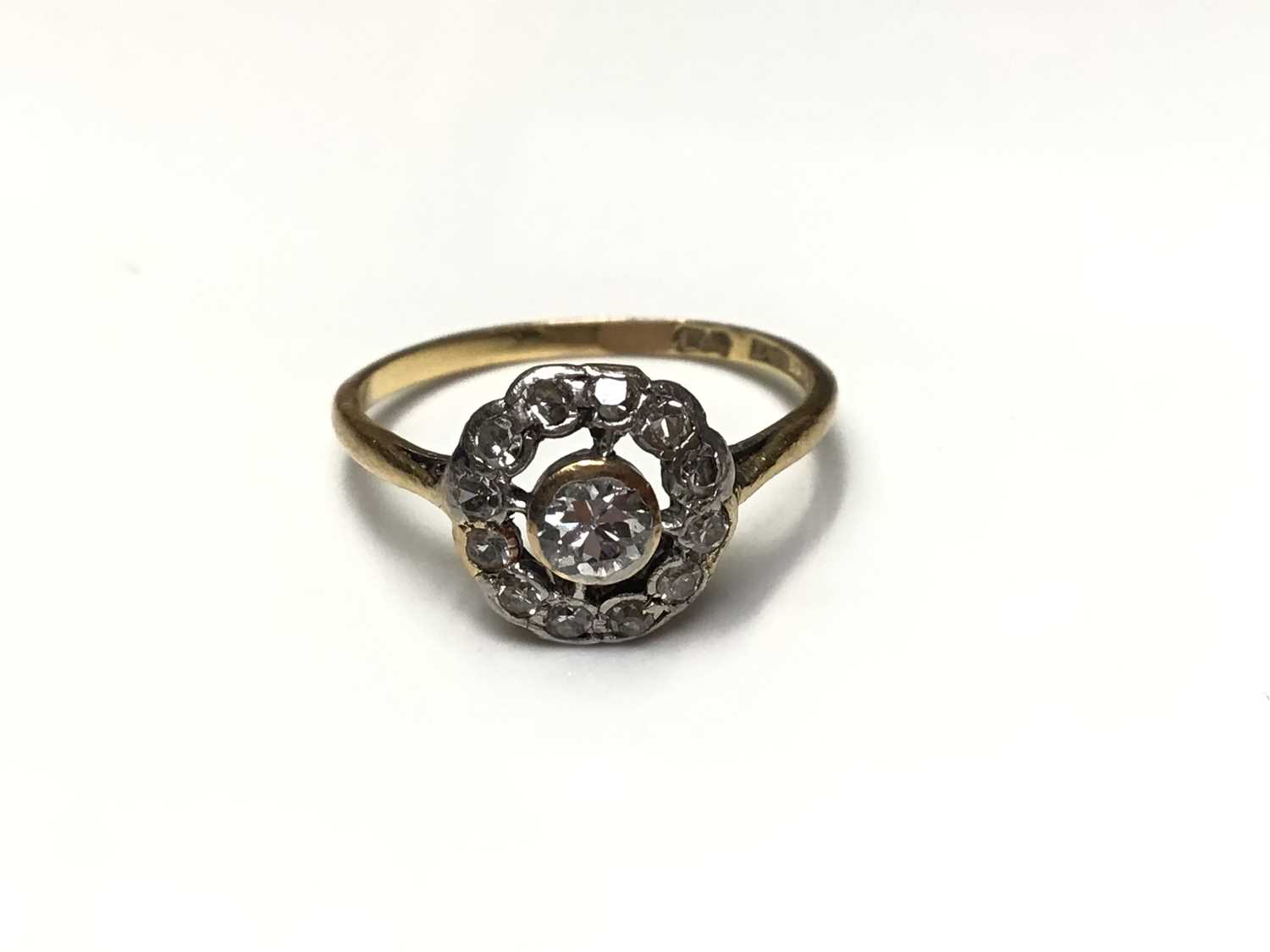 Lot 35 - Antique diamond cluster ring with an openwork cluster of diamonds in platinum setting on 18ct gold shank
