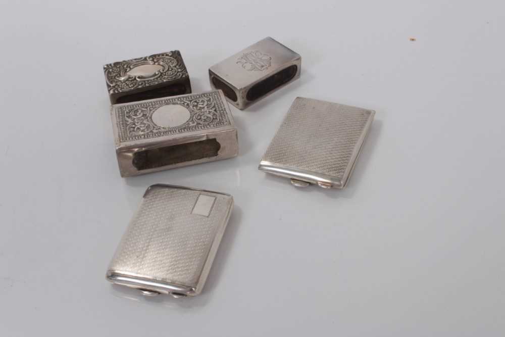 Lot 32 - George V silver matchbook holder with engine turned decoration (Chester 1926) together with another (Chester 1929), two silver match box holders and an Indian white metal match box holder (various...
