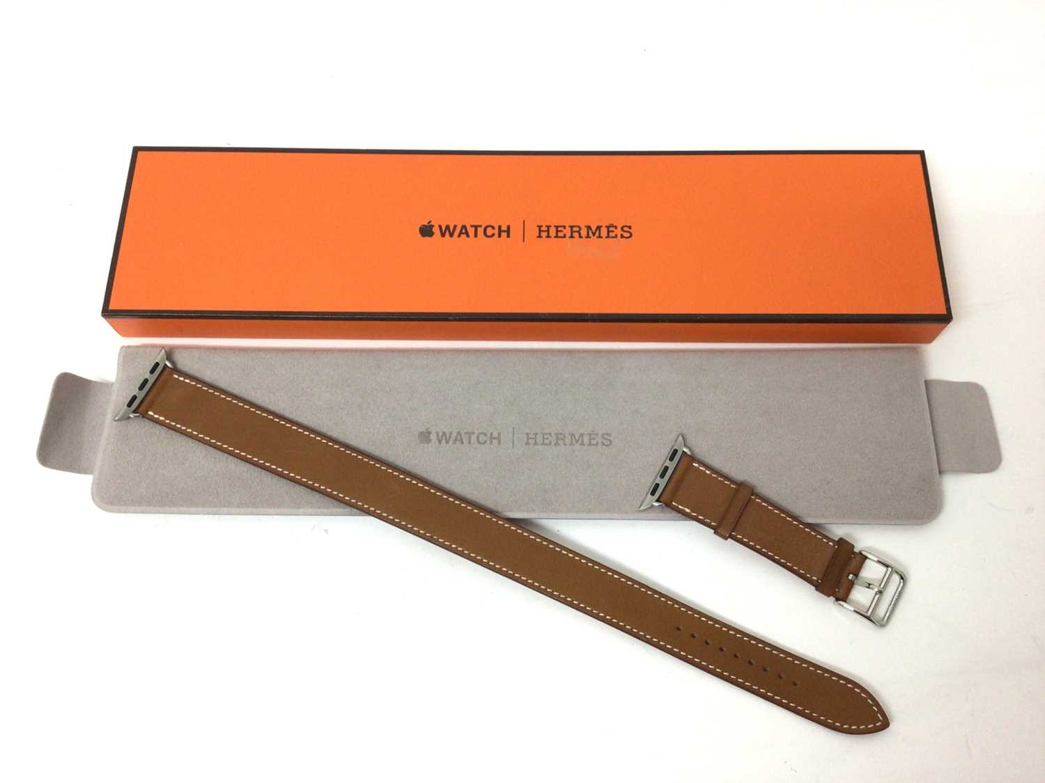 Lot 2086 - Hermes tan leather Apple 'Double Tour' watch strap in original Hermes box, soft pouch and paperwork.