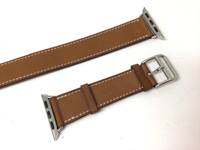 Lot 2086 - Hermes tan leather Apple 'Double Tour' watch strap in original Hermes box, soft pouch and paperwork.