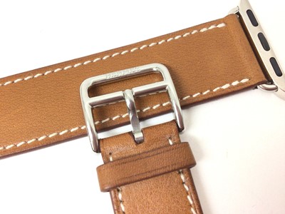 Lot 2086 - Hermes tan leather Apple 'Double Tour' watch strap in original Hermes box, soft pouch and paperwork.