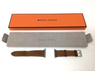 Lot 2087 - Hermes tan leather 'Simple Tour' Apple watch strap in original Hermes box, with soft pouch and paper work.