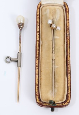 Lot 499 - Two Victorian diamond and pearl stick pins, in a tooled leather box.