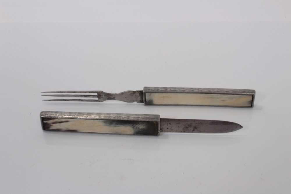 Lot 64 - 19th century travelling / campaign cutlery set with retractable steel knife and fork in silver plated casing with horn mounts, 17.7cm overall.
