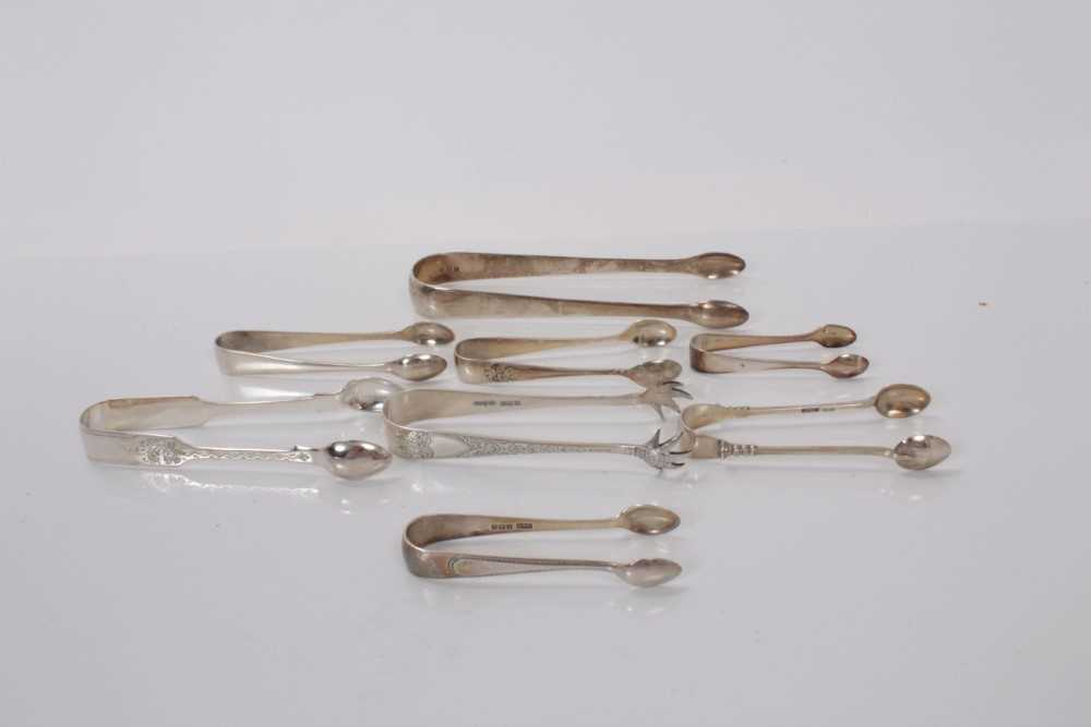 Lot 134 - Seven pairs of Georgian and later silver sugar tongs, together with a pair of silver plated sugar tongs, all at approximately 5ozs (8)