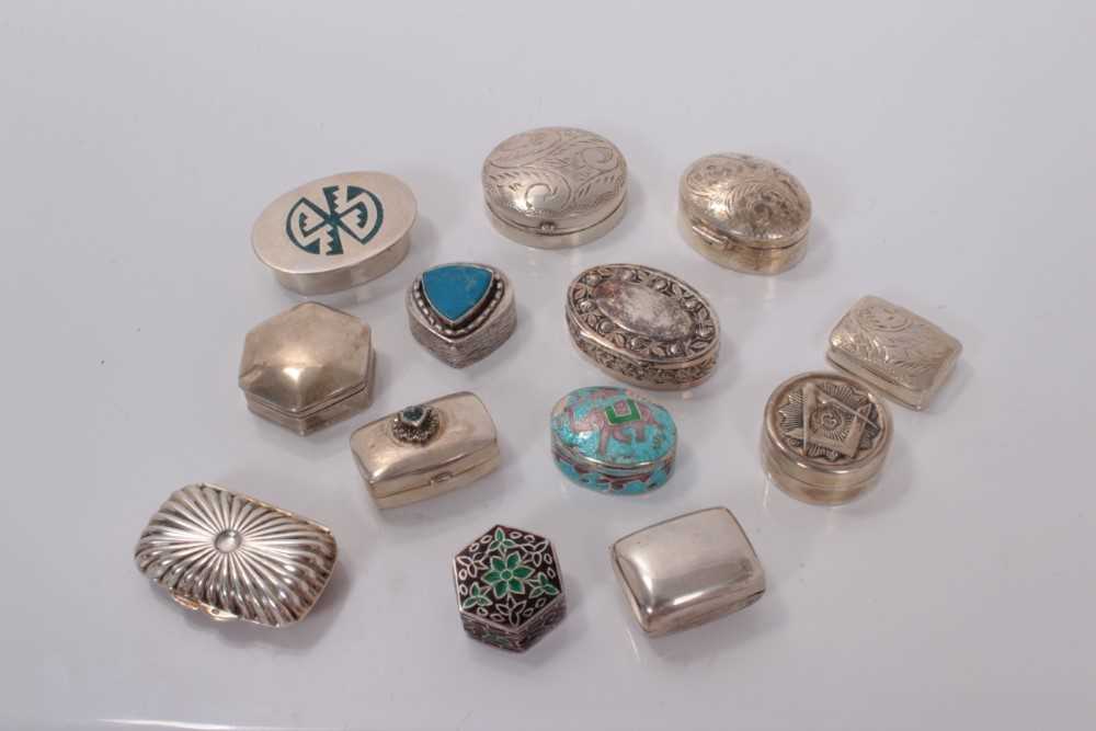 Lot 135 - Group of thirteen contemporary silver and white metal pill boxes, some with enamel decoration, mostly marked 925, all at 5ozs (13)