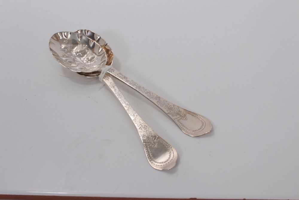 Lot 136 - Pair of early 18th century Britannia silver spoons with later embossed and engraved decoration, marks for London circa 1700, 19.3cm in overall length.(2)