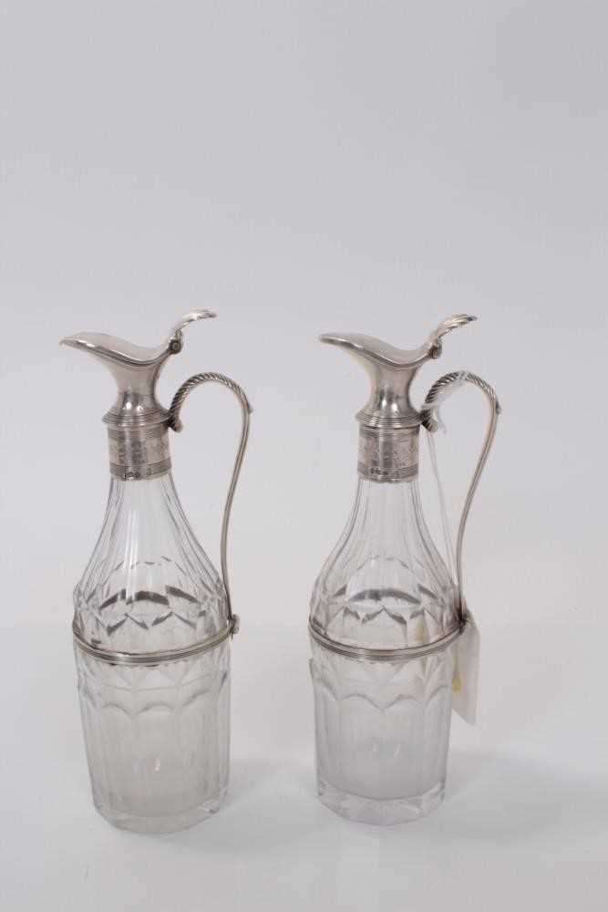Lot 137 - Pair of George III silver mounted cut glass cruet bottles (London 1792), maker Peter and Ann Bateman, 17cm in overall height. (2)