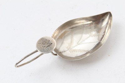 Lot 75 - George III silver leaf-shaped bowl caddy spoon with bright cut decoration and wire loop handle , marks incomplete, maker Cocks and Bettridge, 7cm