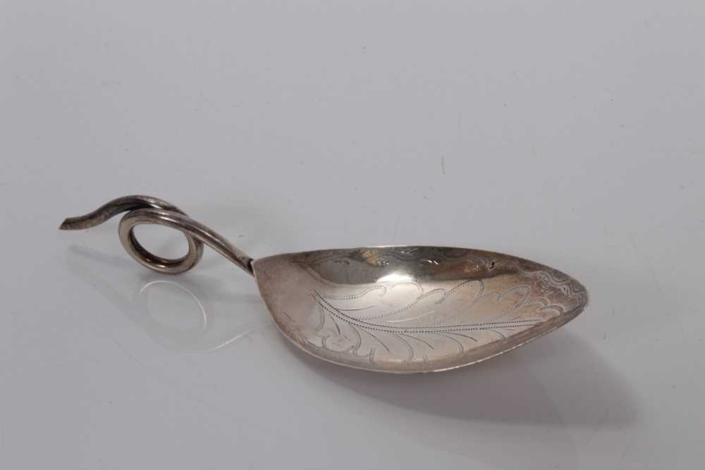Lot 76 - George III silver leaf-shaped bowl caddy spoon with bright cut decoration and loop handle, possibly 1796 maker Edward Mayfield, 11 cm
