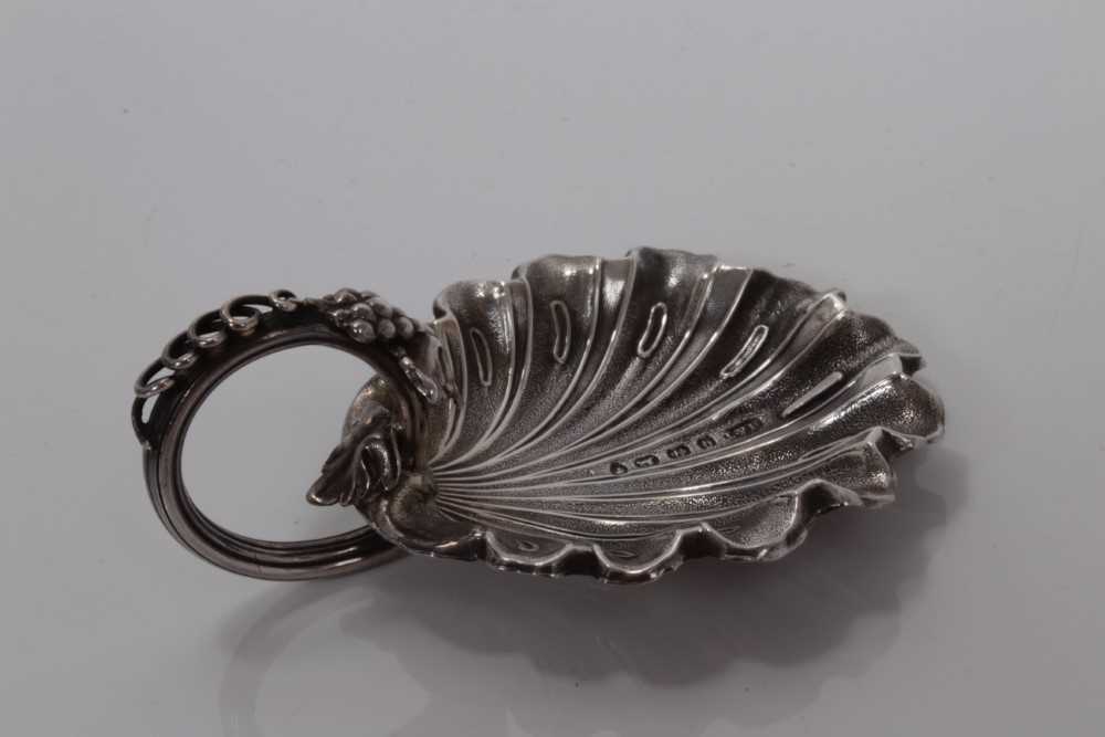Lot 77 - Victorian silver vine leaf bowl caddy spoon with scroll vine and grape handle, Birmingham 1865, maker Hilliard and Thompson 7.2 cm