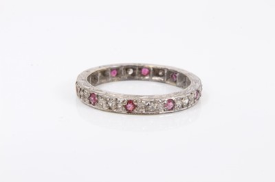 Lot 417 - 9ct white gold diamond and ruby eternity ring
