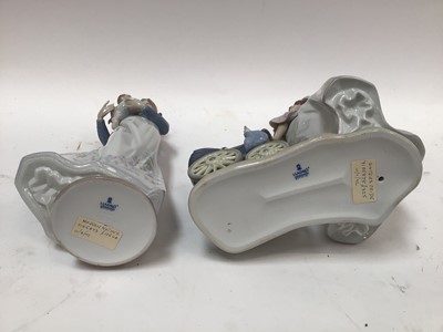 Lot 1061 - Two Lladro porcelain figures - Lady holding baby and Lady with pushchair and baby