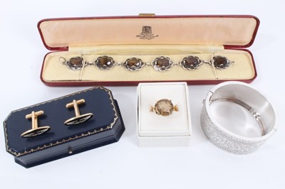 Lot 420 - Group of jewellery to include a silver and smokey quartz bracelet, gold and smokey quartz dress ring, Victorian silver hinged bangle and a pair of Aston Martin cufflinks