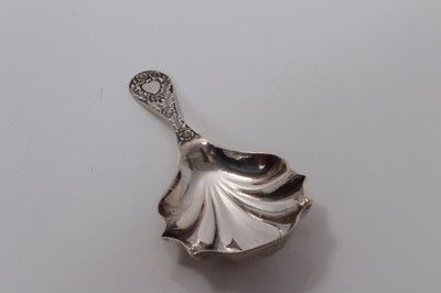 Lot 86 - Edwardian silver shell bowl caddy spoon with cast floral leaf handle, Chester 1905, M.Friedlander & Co.