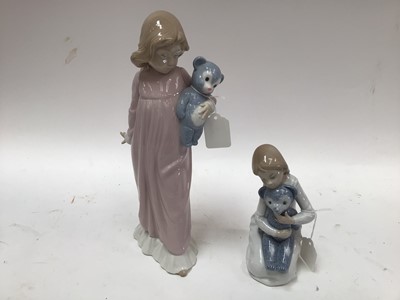 Lot 1067 - Three Lladro porcelain clowns together with two Nao porcelain figures of girls with Teddy bears (5)