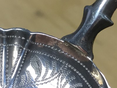 Lot 98 - Victorian silver circular bowl caddy spoon with engraved decoration, Birmingham 1864, Hilliard & Thomason 7cm
