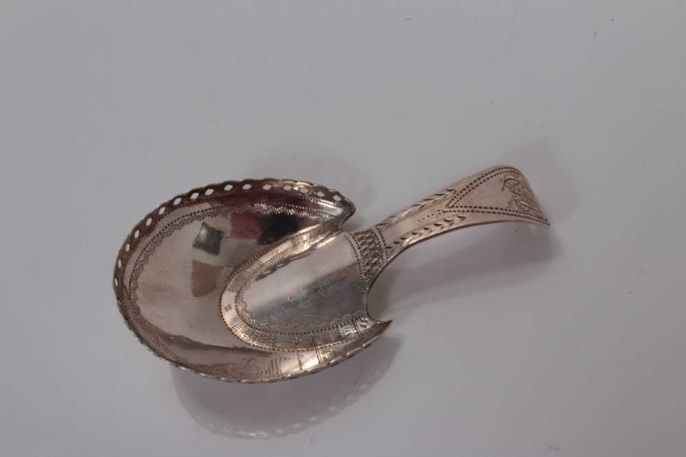 Lot 105 - George III horseshoe bowl caddy spoon with bright cut decoration , Birmingham 1806, maker marks rubbed, 7cm