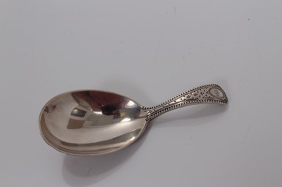 Lot 110 - Victorian silver teardrop bowl caddy spoon with engraved floral handle, London 1870, George Adams 8.5 cm