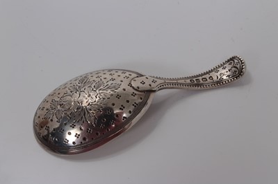 Lot 110 - Victorian silver teardrop bowl caddy spoon with engraved floral handle, London 1870, George Adams 8.5 cm
