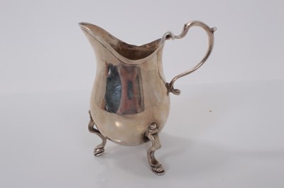 Lot 158 - George V silver milk jug of baluster form, raised on three hoof feet, (London 1929), maker Goldsmiths & Silversmiths Company Ltd, 7ozs, 12.5cm in overall height