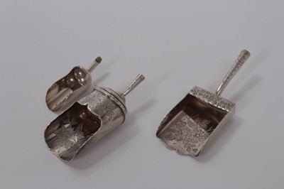 Lot 119 - Three  Victorian silver shovel- shaped caddy spoons- handles lacking