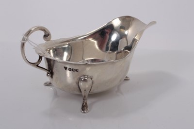 Lot 161 - George V silver sauce boat of helmet form, (Sheffield 1932), 4oz, 14.5cm in length.