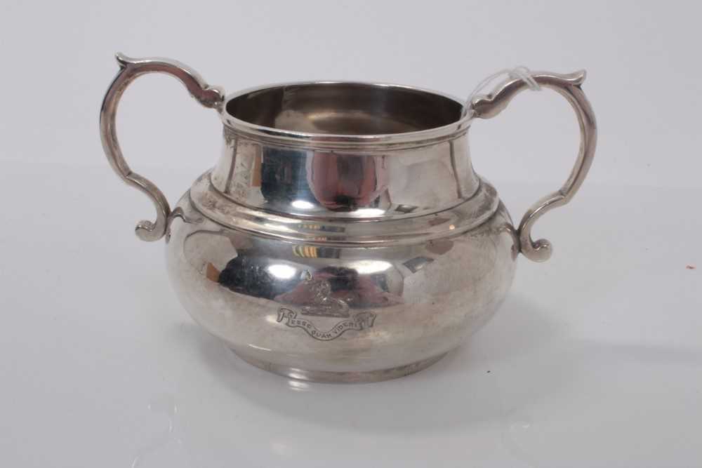 Lot 162 - George VI silver sugar bowl of cauldron form with engraved armorial and presentation inscription to underside, (London 1937), 7ozs, 15cm in diameter