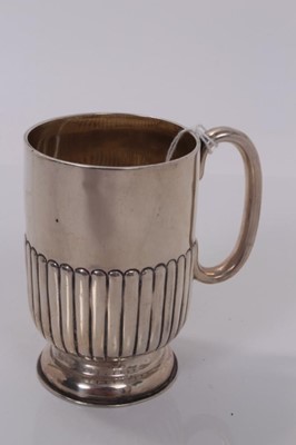 Lot 164 - Victorian silver christening mug with fluted decoration, (London 1895), maker William Hutton & Sons Ltd, 2ozs, 9cm in overall height.