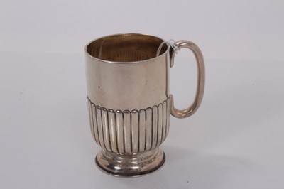Lot 164 - Victorian silver christening mug with fluted decoration, (London 1895), maker William Hutton & Sons Ltd, 2ozs, 9cm in overall height.