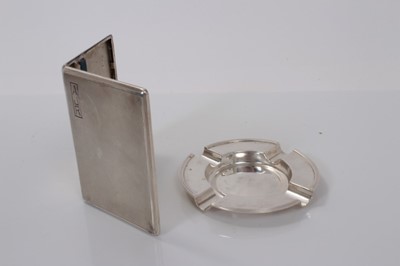 Lot 165 - George VI silver cigarette case of rectangular form, with engine turned decoration and engraved initials 'A. J. R.', (London 1945), together with a George V silver ashtray, (Chester 1913), all at 8...