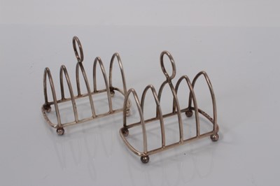 Lot 168 - Pair of George V silver four division toast racks (Birmingham 1923 / Chester 1924), maker Haseler & Bill, all at 2ozs (2)