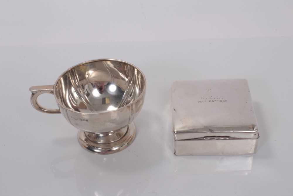 Lot 171 - Edwardian silver christening mug with engraved naming 'Juilet' on circular pedestal foot, (London 1903) together with an Edwardian silver cigarette box of square form, with engraved inscription, (L...